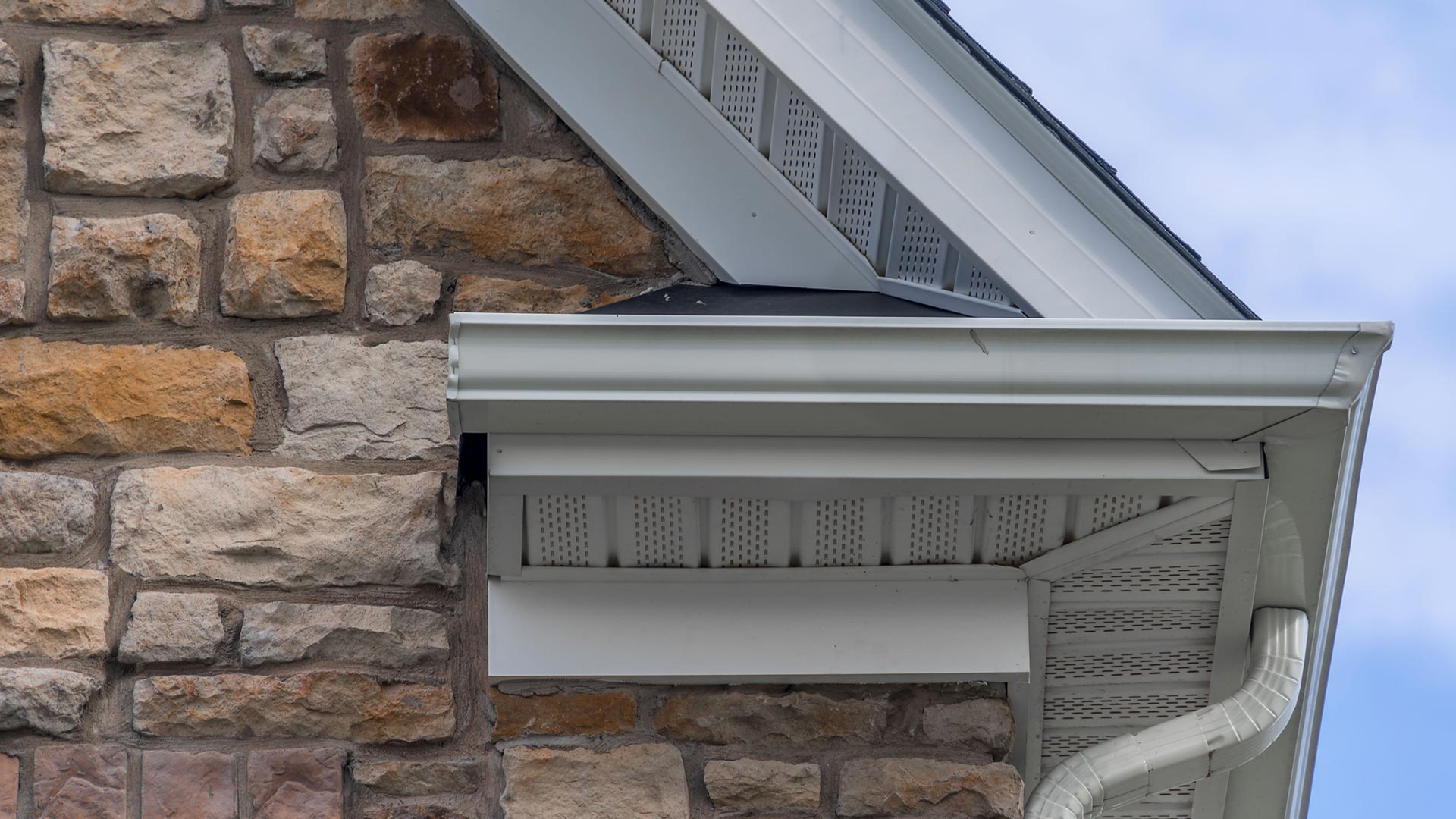 home-with-stone-cladding-and-white-gutters-middletown-ct